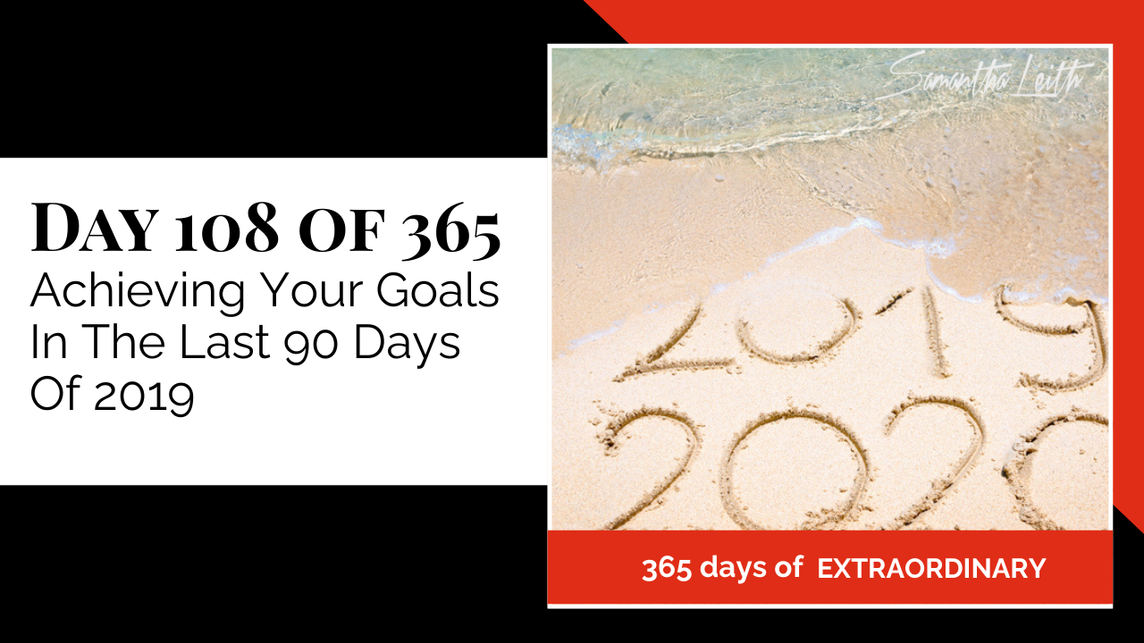 Blog image for Day 108 of Sam Leith's '365 Days of Extraordinary' series, showing the numbers '2019' and '2020' written in the wet sand on a beach as a gentle wave washes in, symbolizing a year-end transition and achieving goals.