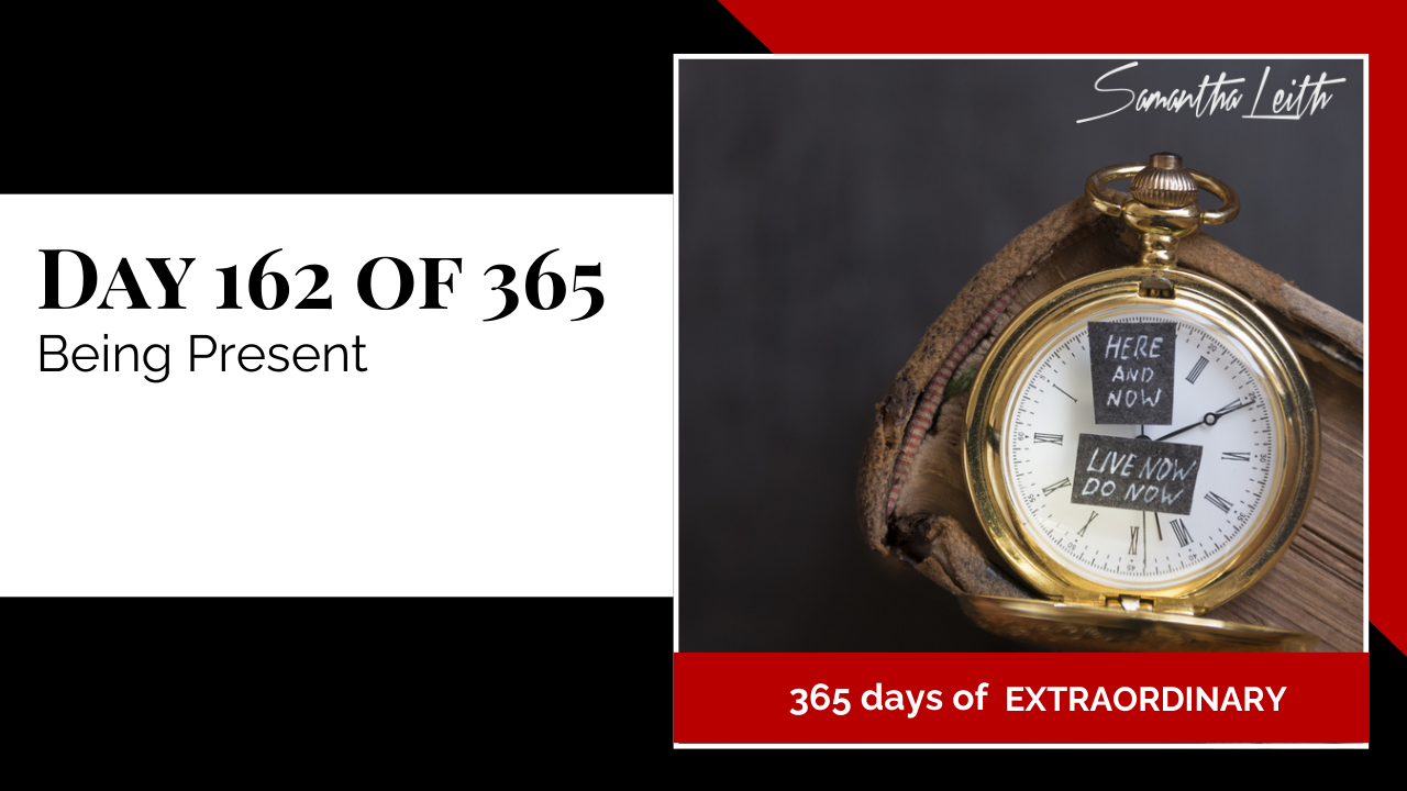 Close-up of a vintage brass pocket watch with a modified face featuring handwritten sticky notes emphasizing mindfulness and presence ("Live Now Do Now"), serving as a metaphor for time management and focusing on the current moment.