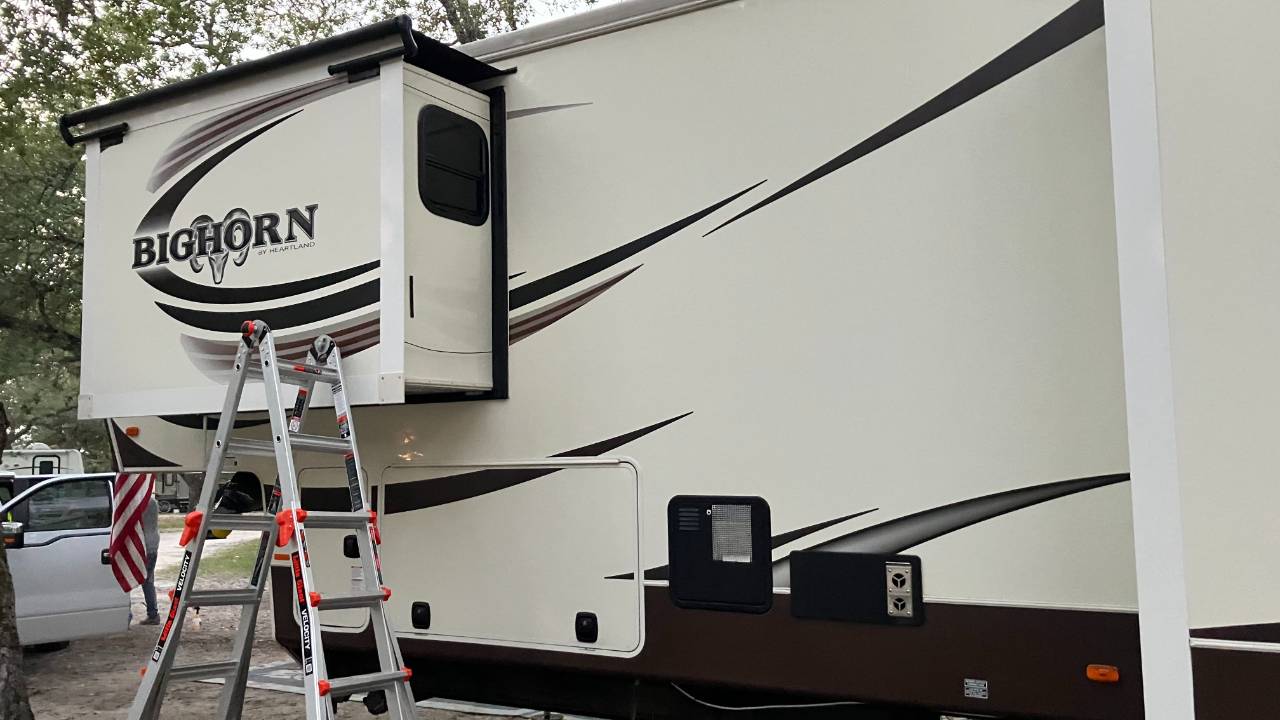 Rv with ladder near