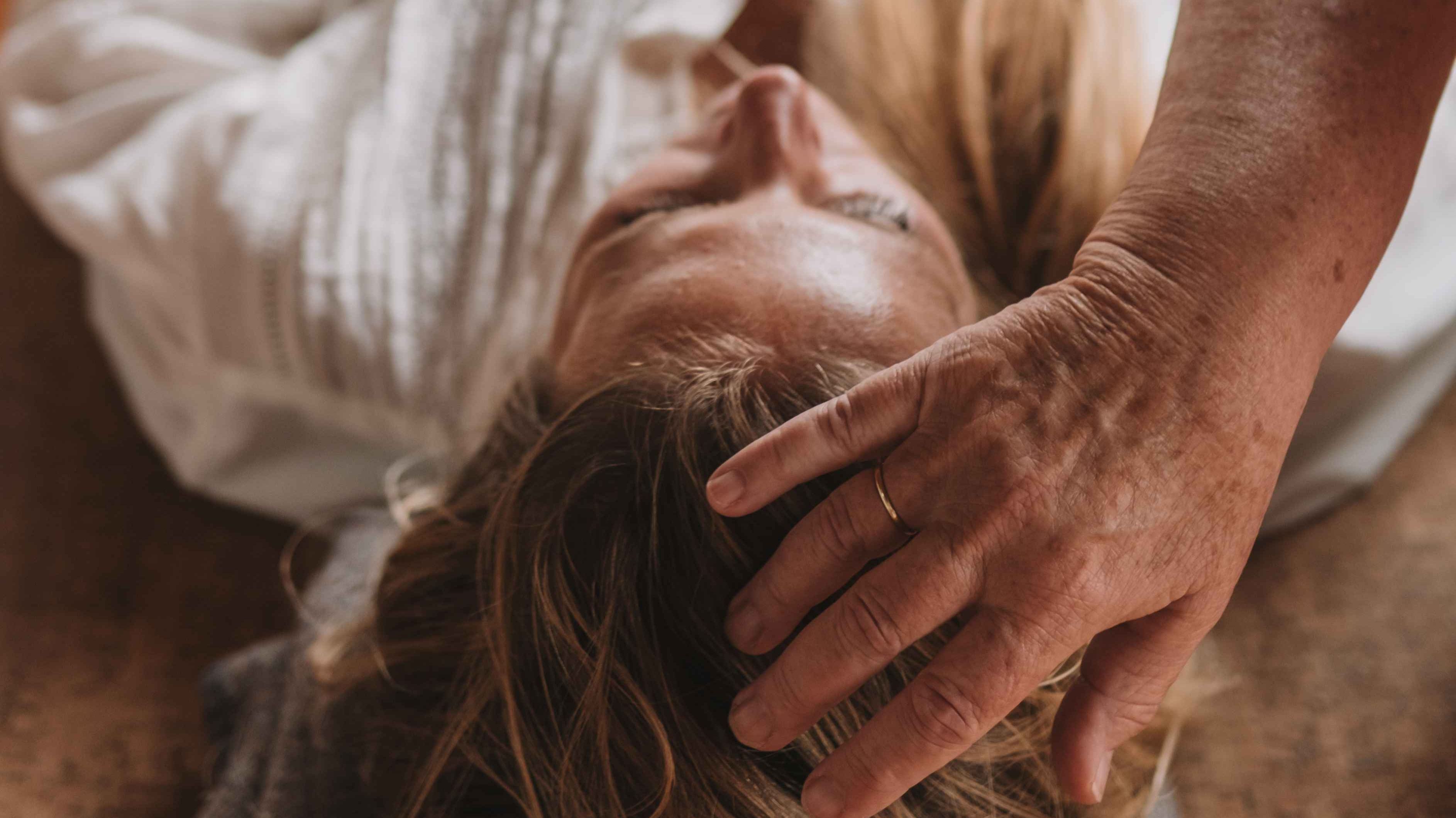 woman reflecting on mind-body connection, healing patterns and nervous system awareness