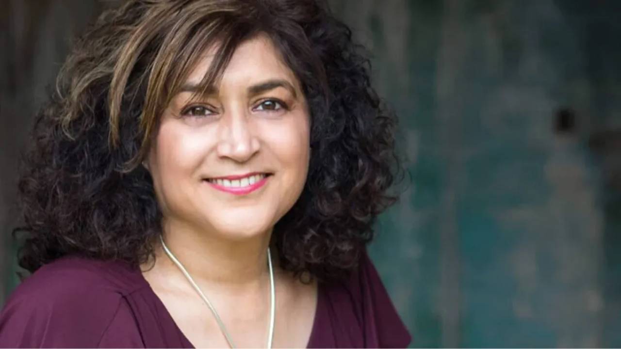 Perm Bassi smiles at camera