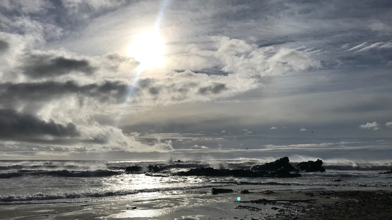 Dark ocean at sunrise representing natural sleep and nervous system calm