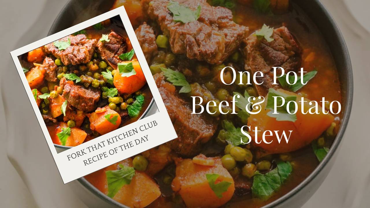 Bowl of beef and potato stew with tender beef chunks, potatoes, and peas in rich tomato broth