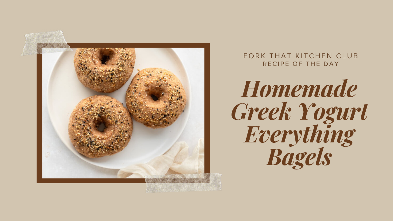 Three golden homemade Greek yogurt everything bagels on a white plate, topped with sesame seeds and everything bagel seasoning (sesame seeds, poppy seeds, and dried onion flakes)