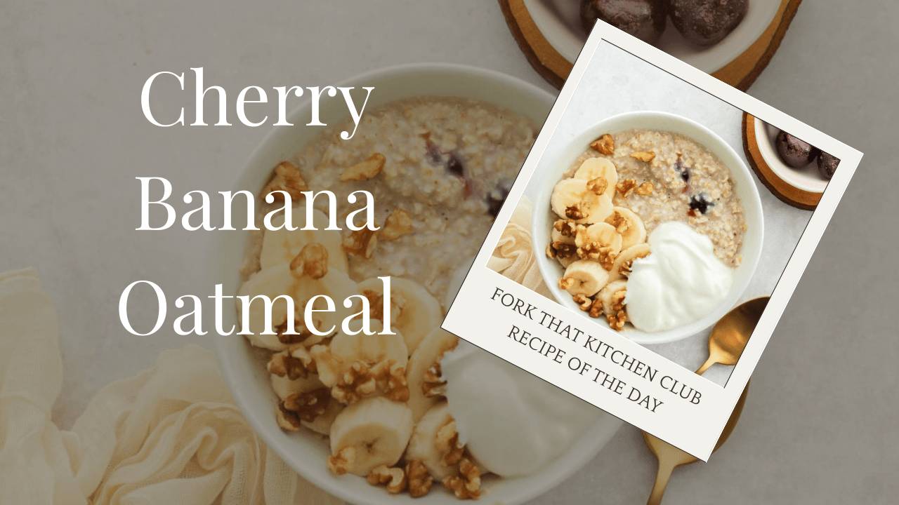Bowl of cherry banana oatmeal with Greek yogurt, sliced banana, and chopped walnuts on white surface with cream linen napkin and a gold spoon to the side, and a small white bowl of cherries in background