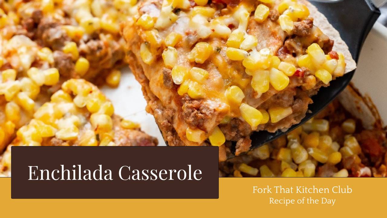 Square of layered enchilada casserole with melted cheddar cheese and corn on top being lifted with black spatula from a white casserole dish