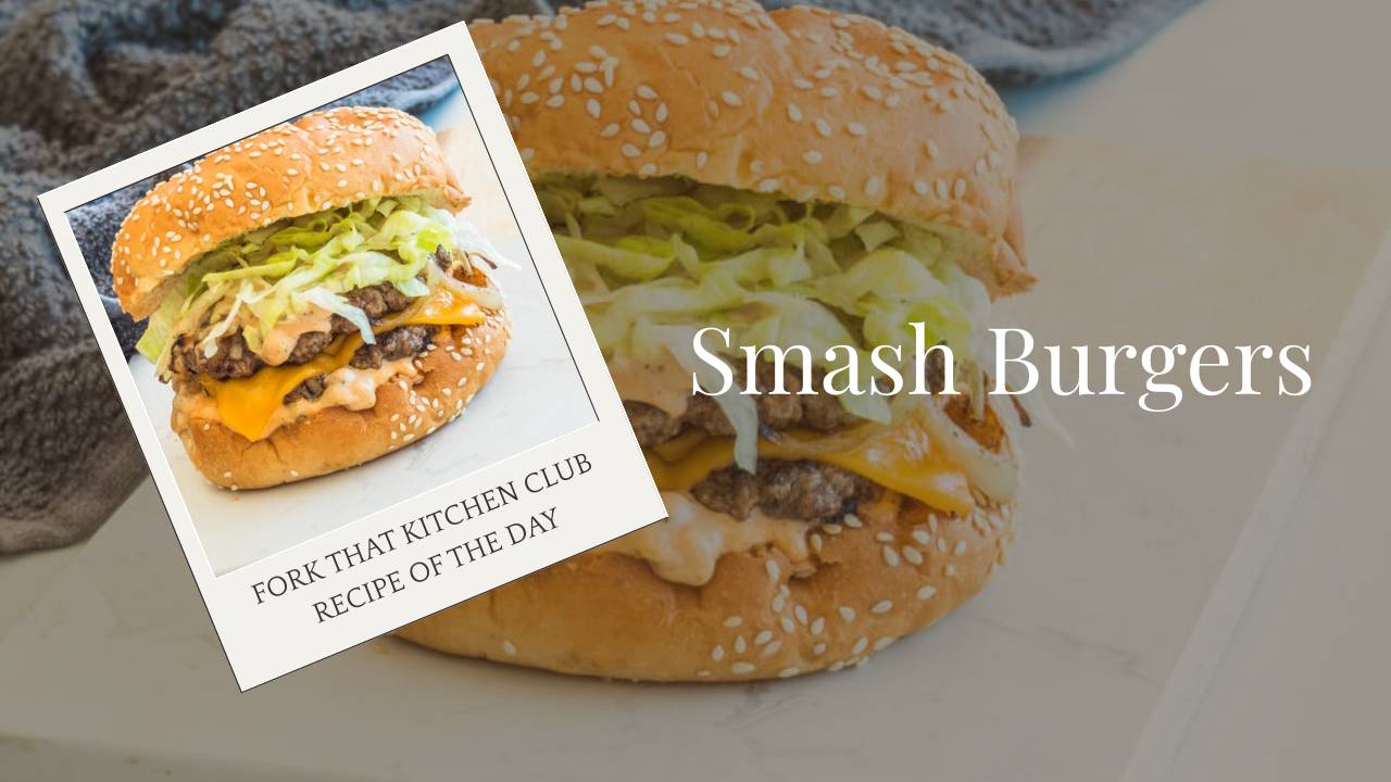 Double-stacked smash burger with melted cheddar cheese and shredded lettuce on toasted sesame bun
