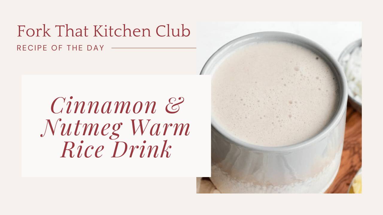 Glass of creamy beige rice drink with cinnamon sprinkled on top and frothy appearance