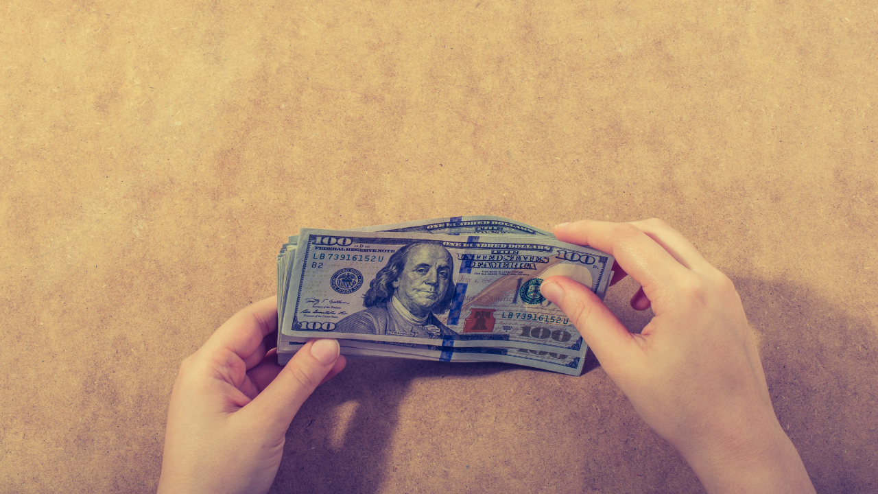 counting money on table