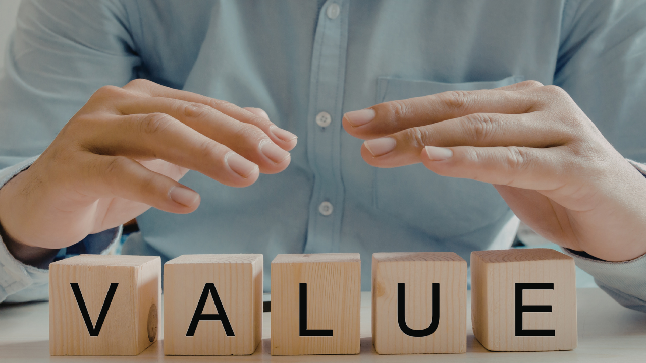 value in blocks with hands above