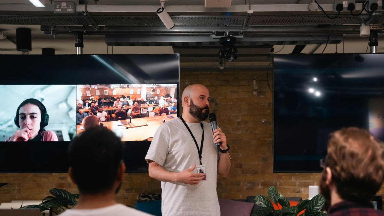 Hybrid event showing in-person attendees and virtual participants engaging together.