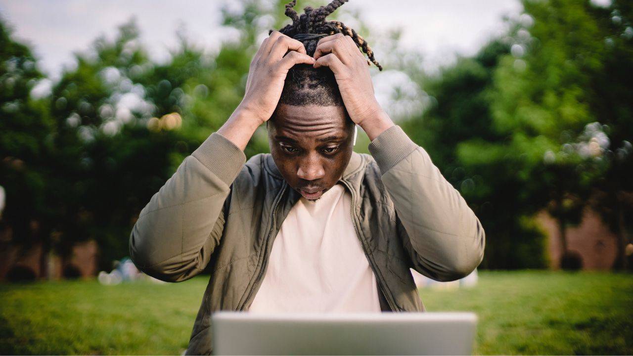 man-holding-his-head