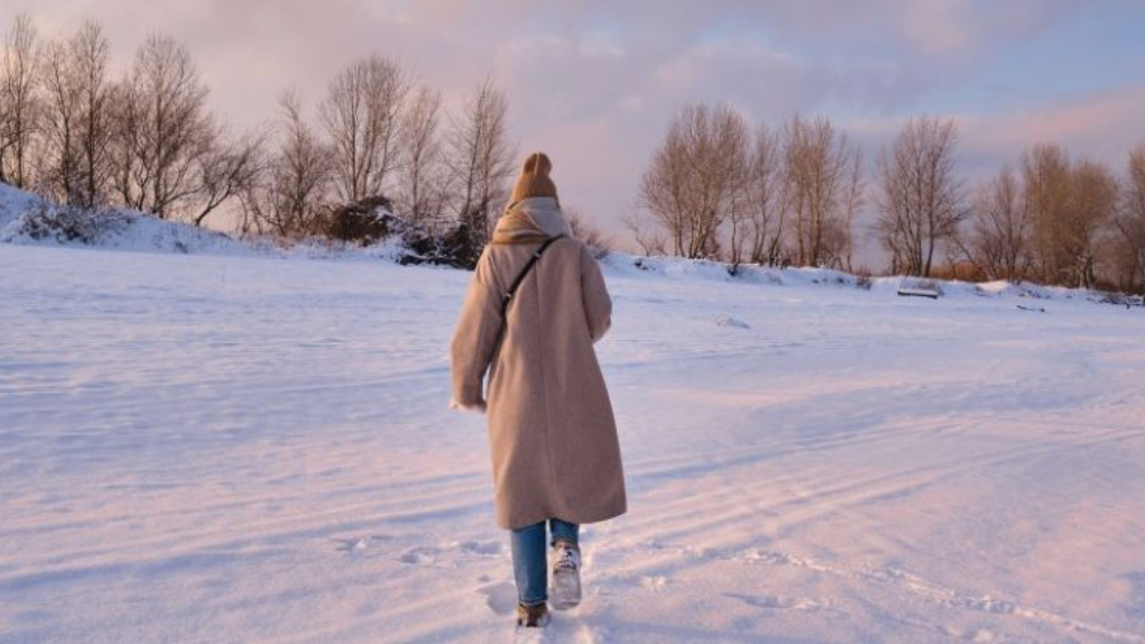woman walking in the snow thinking