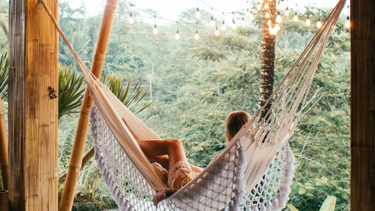 Woman resting peacefully in soft morning light, symbolizing relief, rest, and safety after burnout.