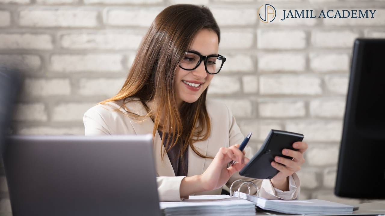 Realtor using an income calculator to plan closings, clients, and monthly leads