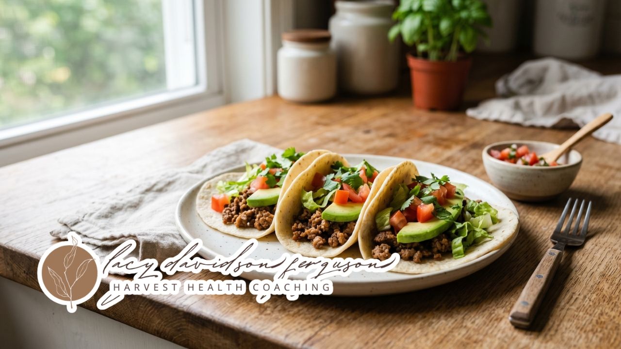 paleo tacos with avocado and fresh vegetables on a plate in natural light