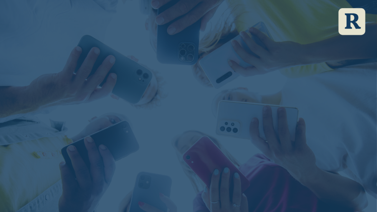 teens holding cell phone screens