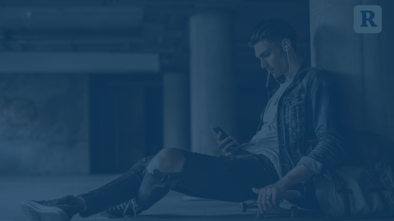 rebel teen looking at cellphone