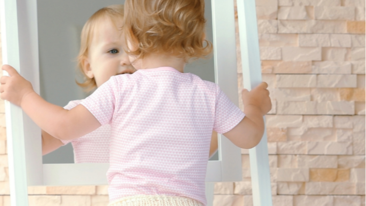 baby in mirror