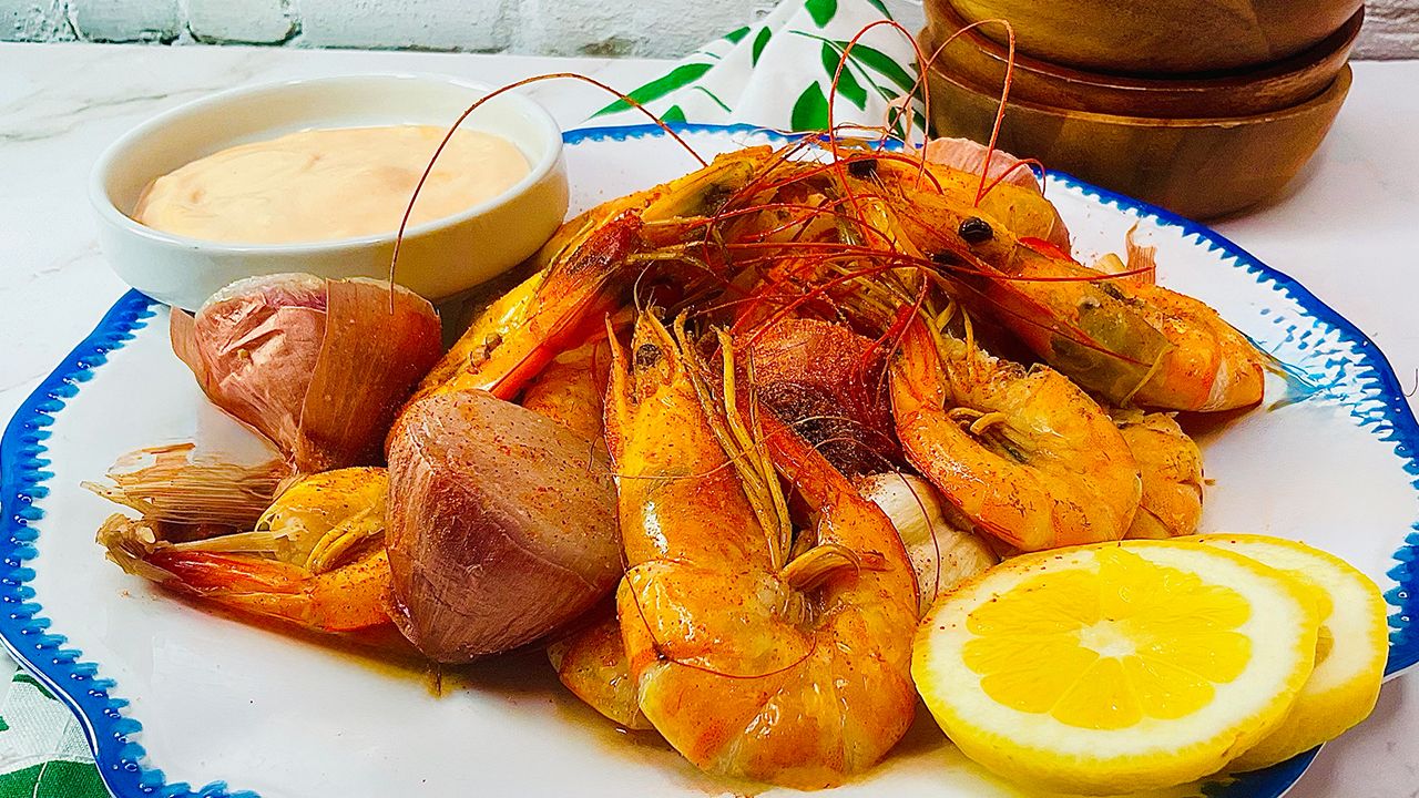 Cajun boiled shrimp with lemon and crab boil seasoning.