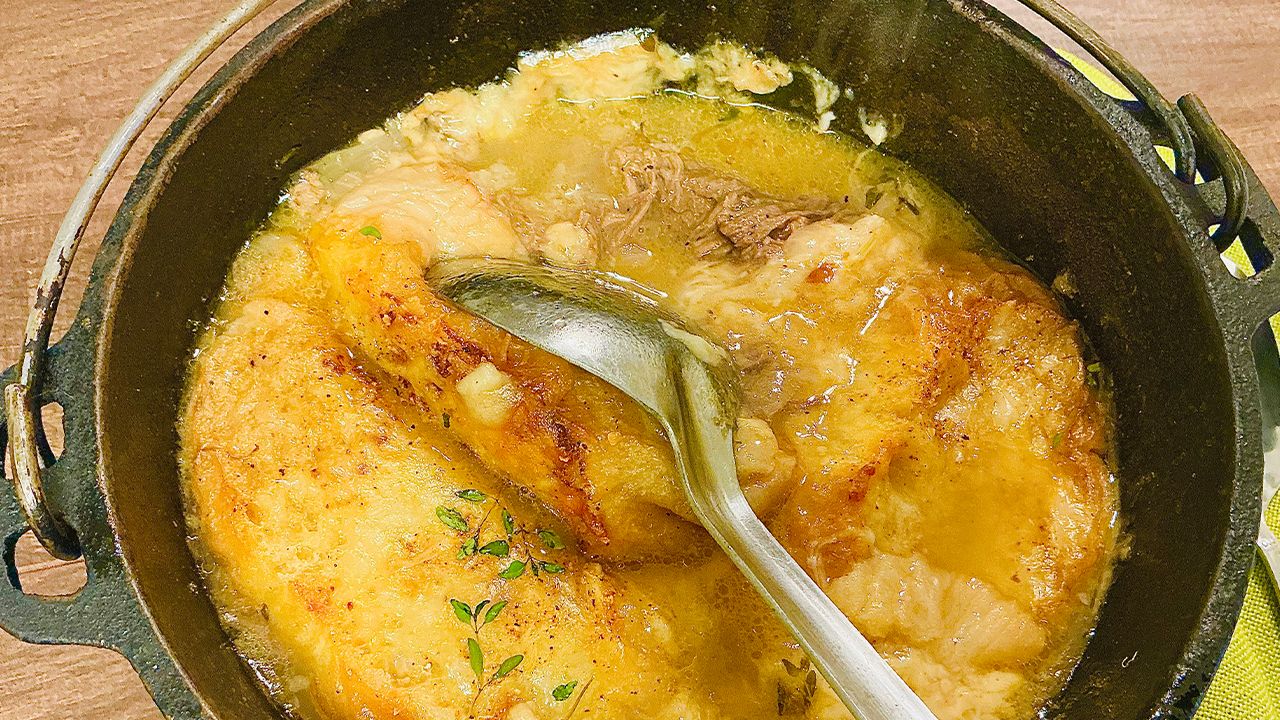 French onion soup topped with toasted bread and melted cheese.