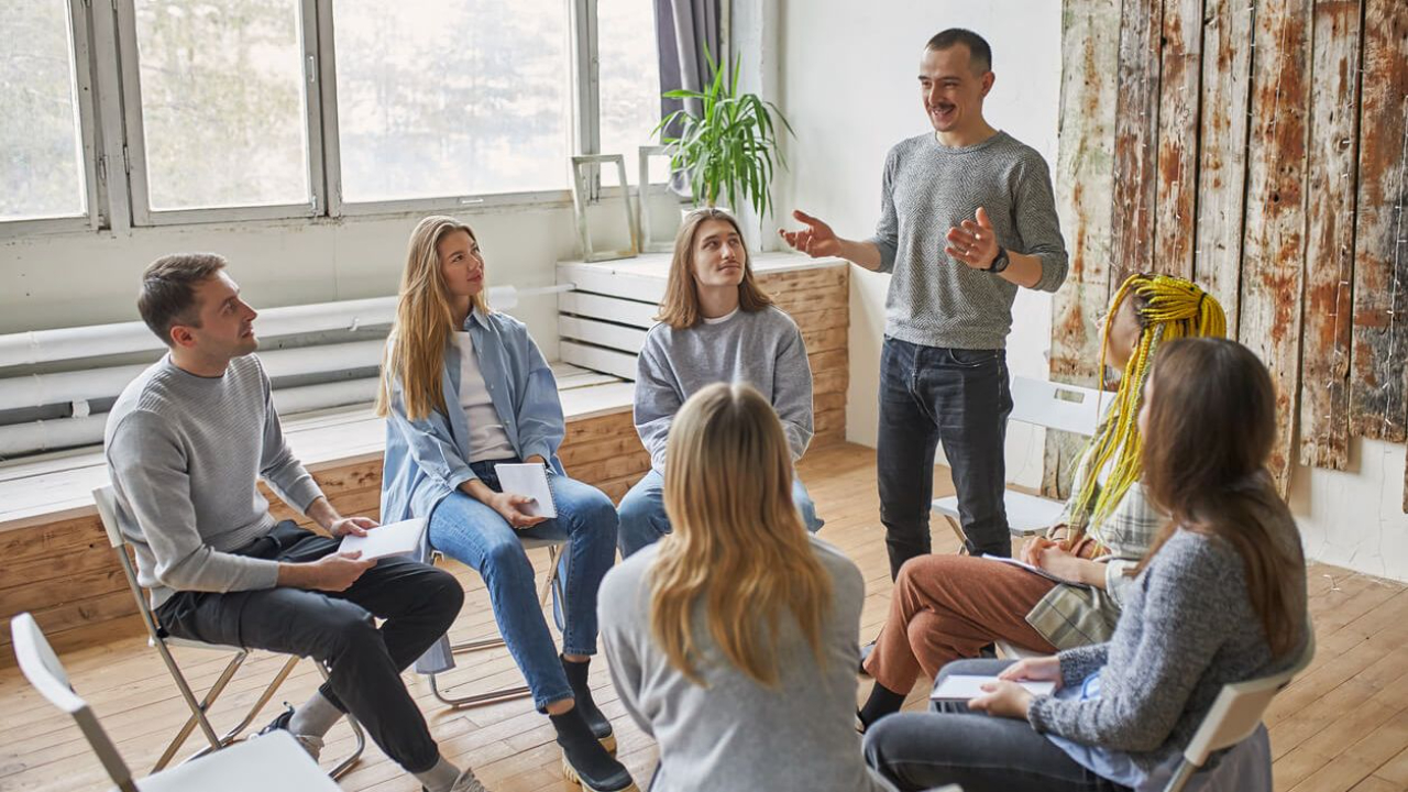 Team coaching session in Los Angeles with professionals collaborating in a group setting