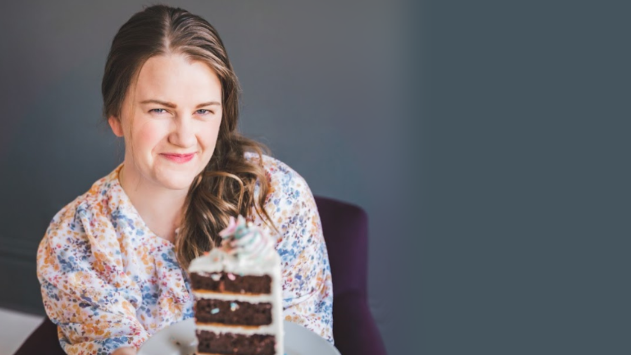 changing your mindset in your business, a home baker with a slice of homemade cake running a business