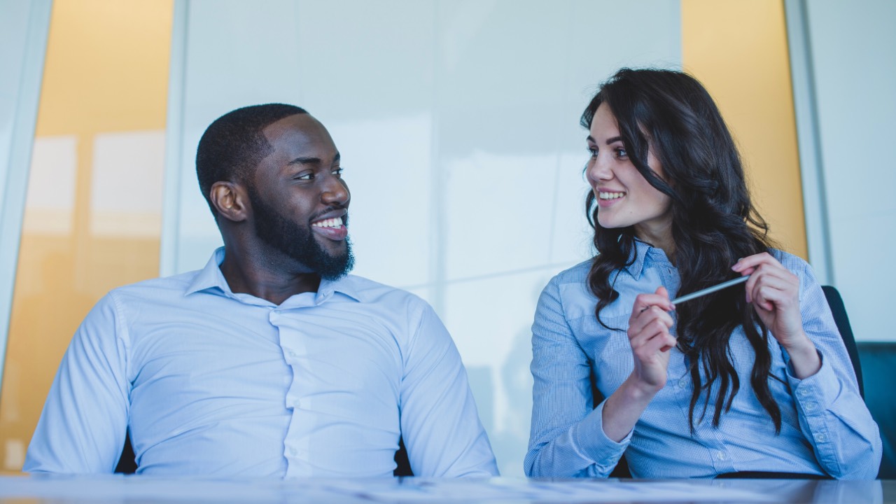 Team members resolving a conflict through open communication and collaboration