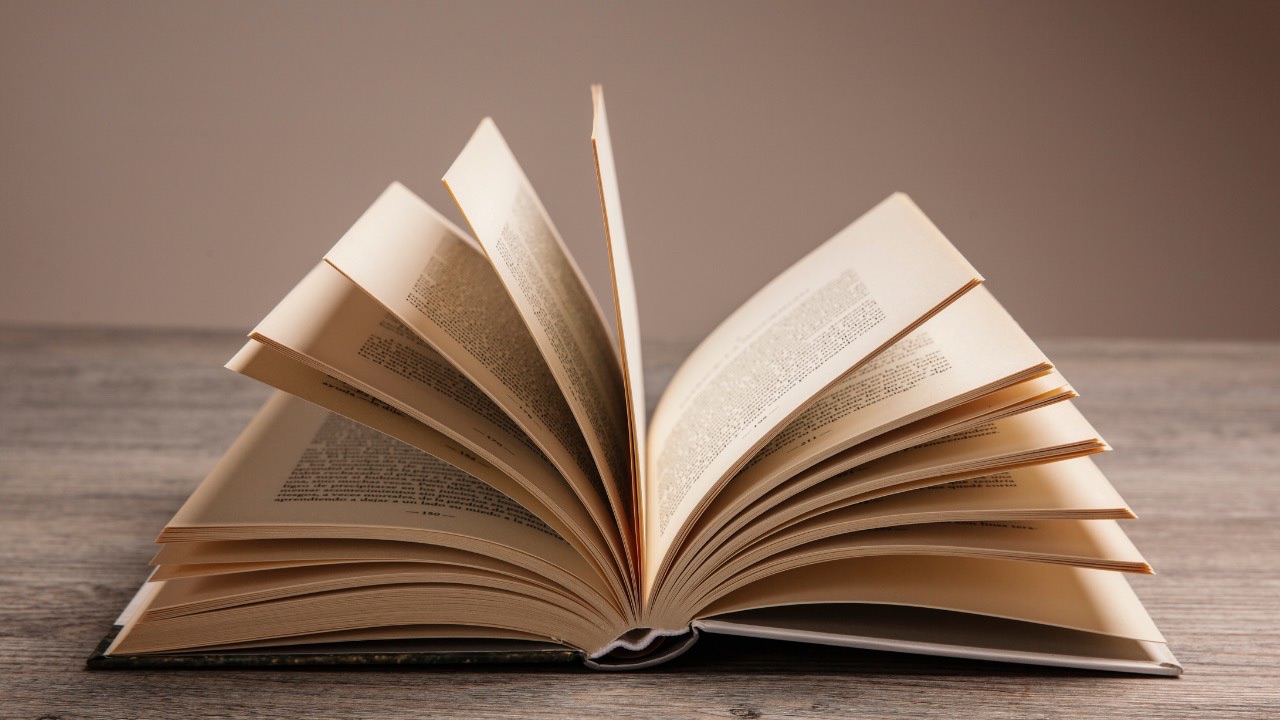 Image of an open book symbolising the stories we tell ourselves and the power of self-reflection in leadership and personal growth