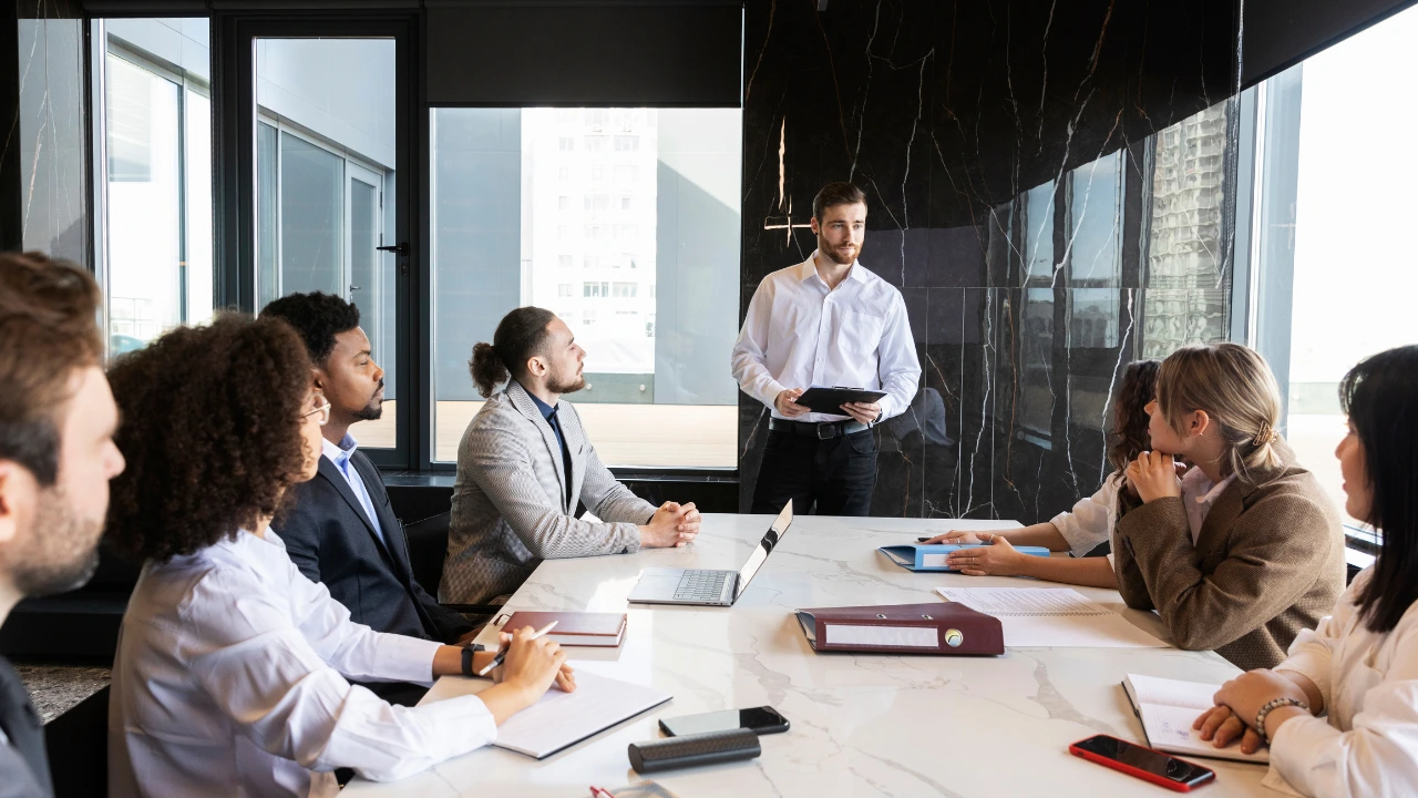 Board meeting representing unseen conflict in leadership meetings.