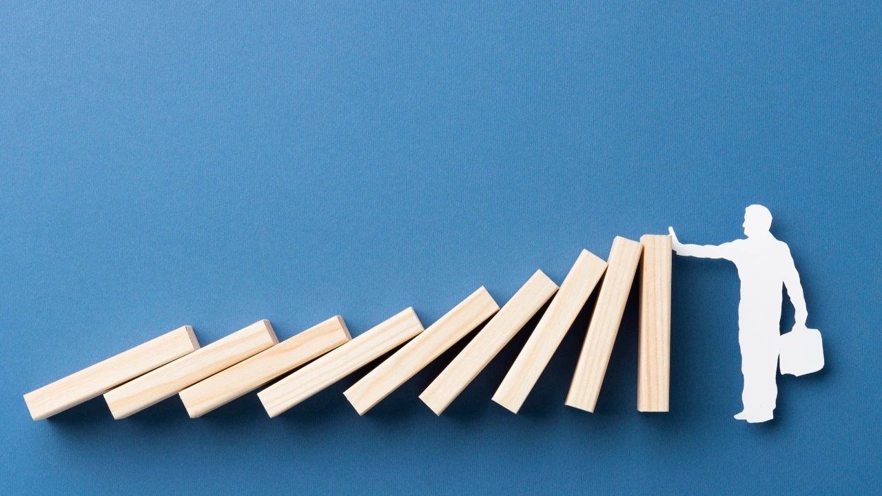 Top view wooden pieces arrangement to represent the biggest threat to change management, its not strategy 