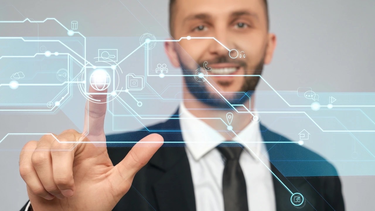 A human hand deliberately rewiring a complex digital process flowchart, symbolising the use of emotional intelligence to break and redesign rigid organisational systems.