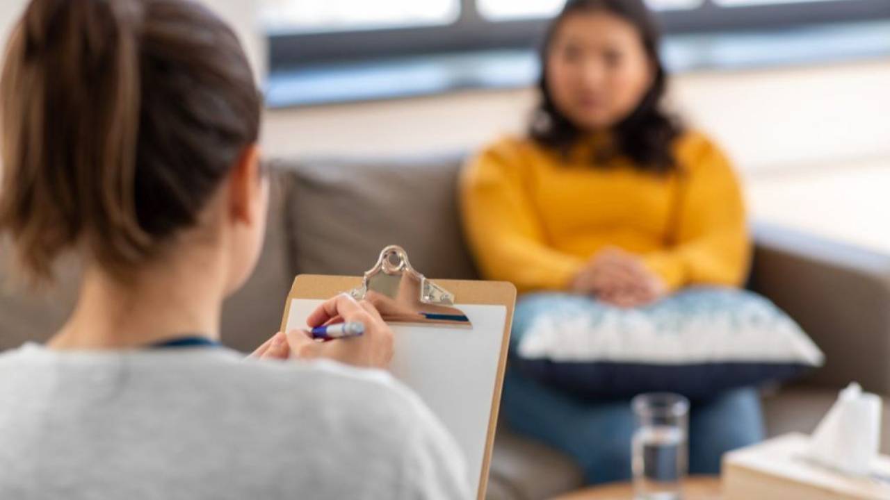 Therapist takes notes