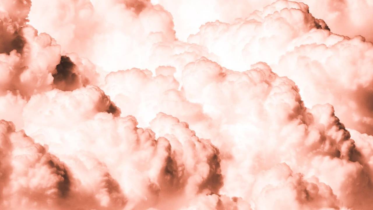 Photo of Fluffly Pink Clouds Bursting Across the Sky