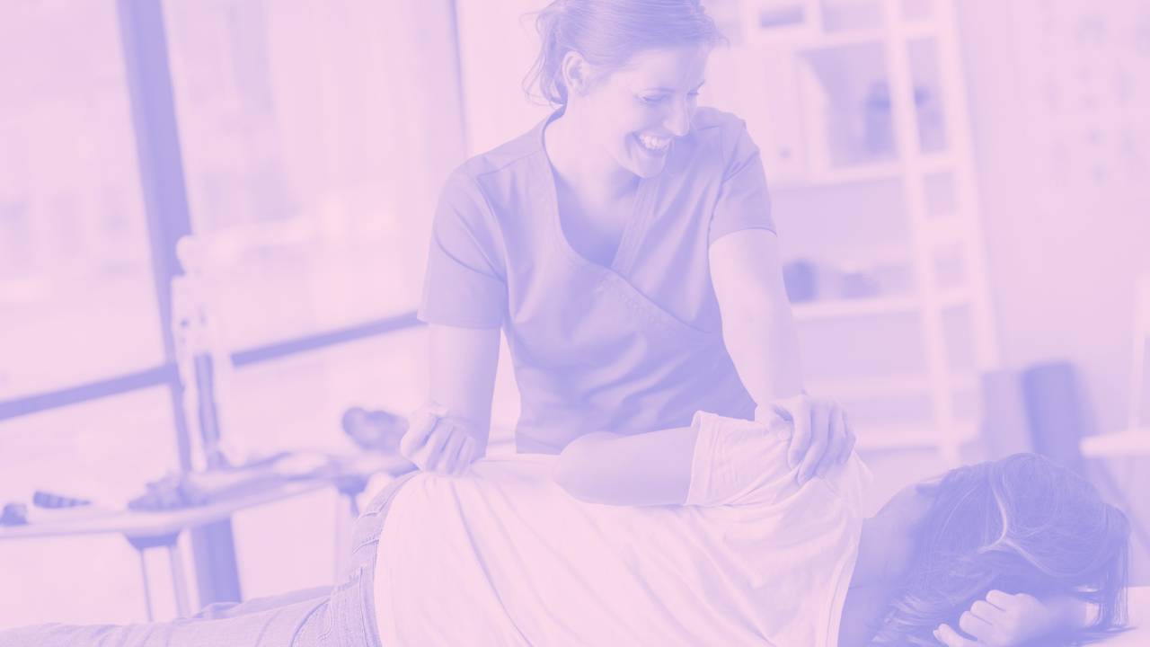 Happy Chiropractor adjusting a patient