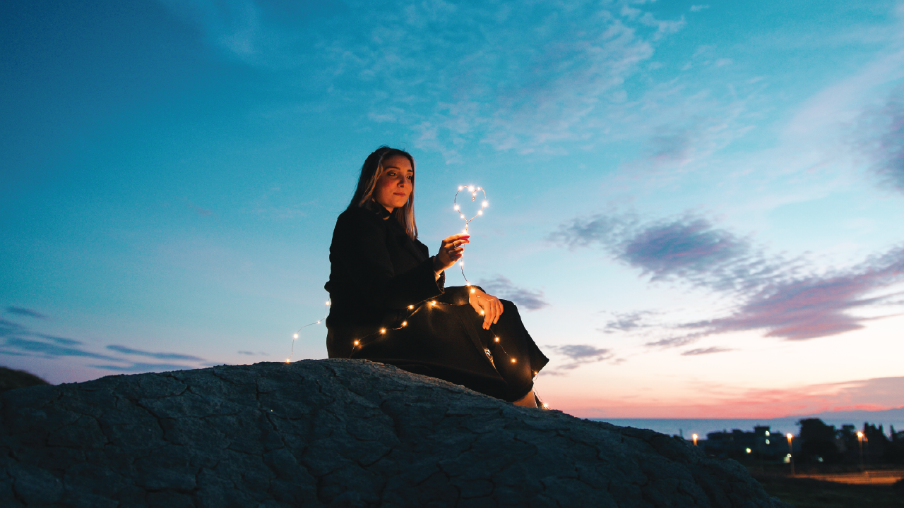 women with fairy lights