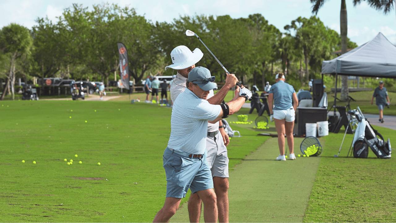 Eric Cogorno coaching a student during golf school at Don Law Golf Academy