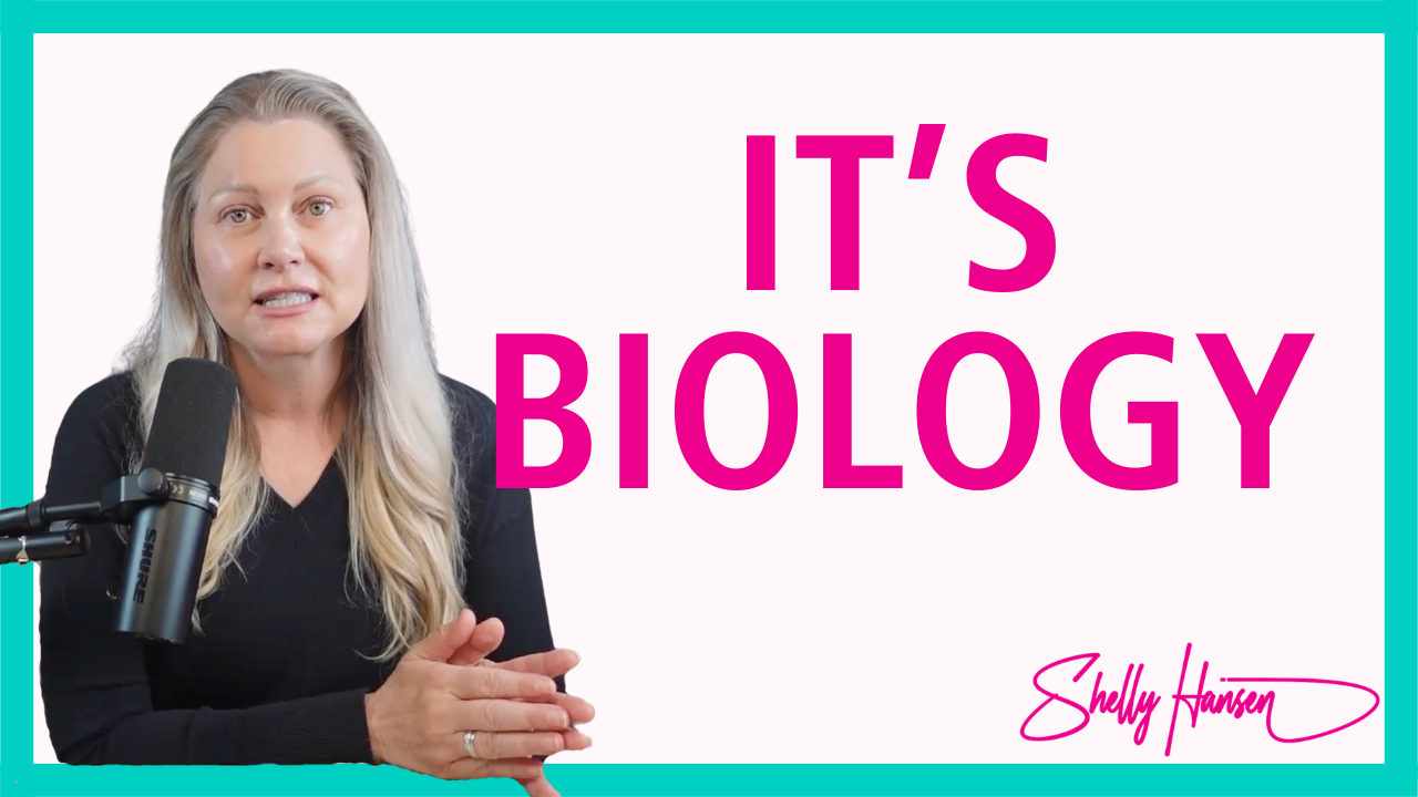 Shelly Hansen seated at a desk with a microphone, speaking about nervous system patterns and identity change on her podcast.