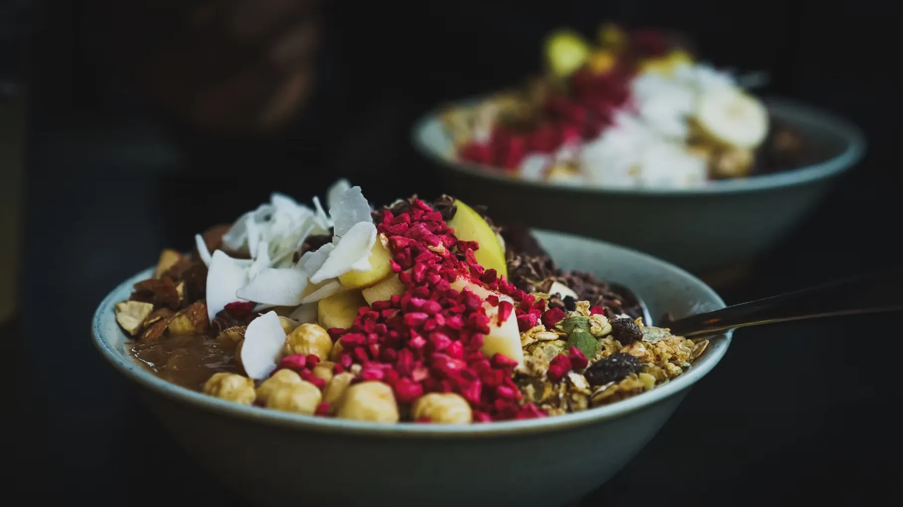 Bowls of oats with healthy toppings