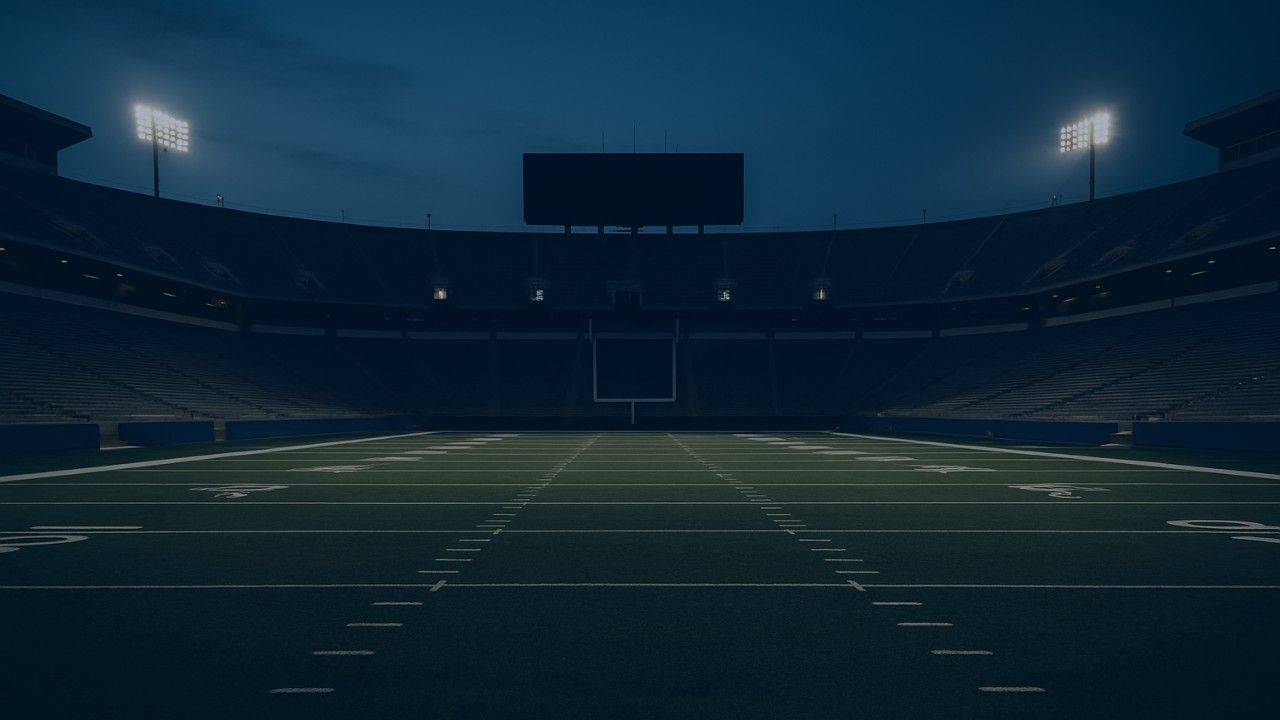 Empty college football stadium at dusk