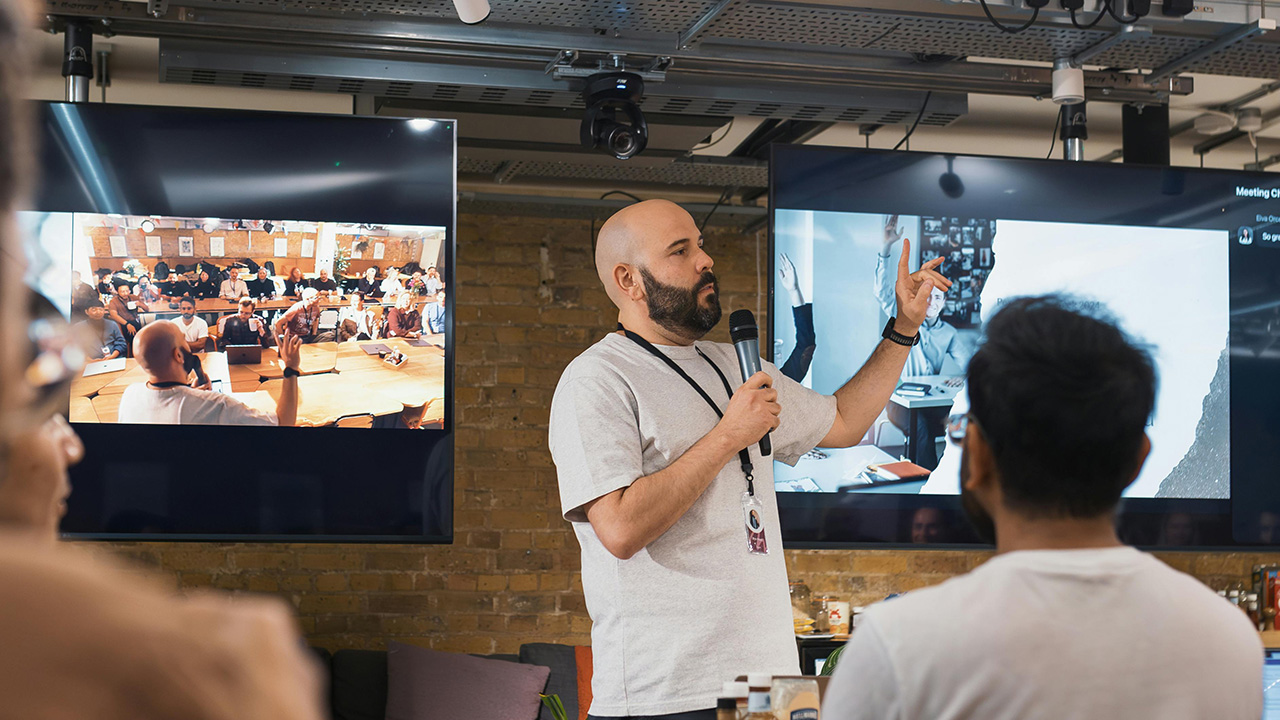 Confident creative professional teaching and sharing expertise after strategic education