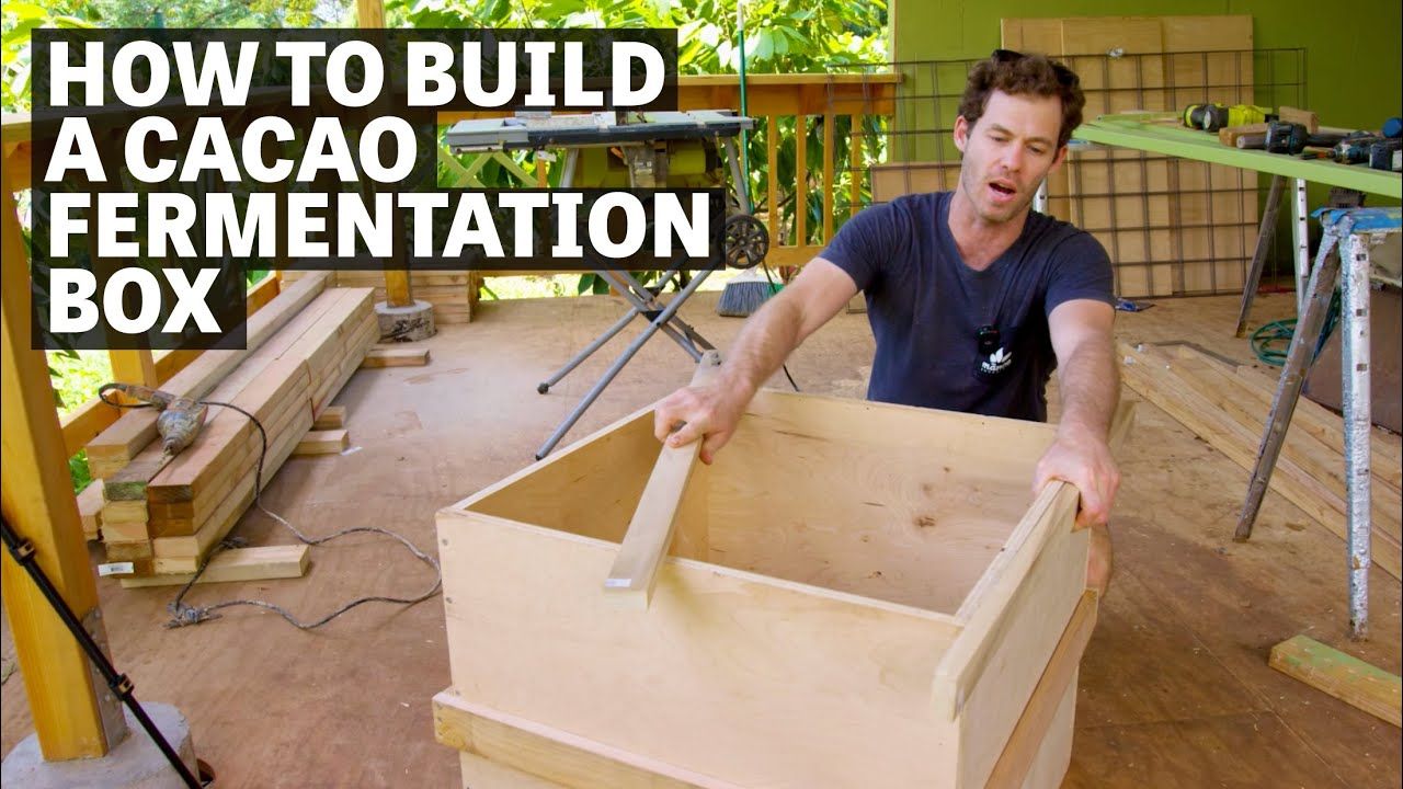 Image of a person building a cacao fermentation box with text reading "How to Build A Cacao Fermentation Box". 