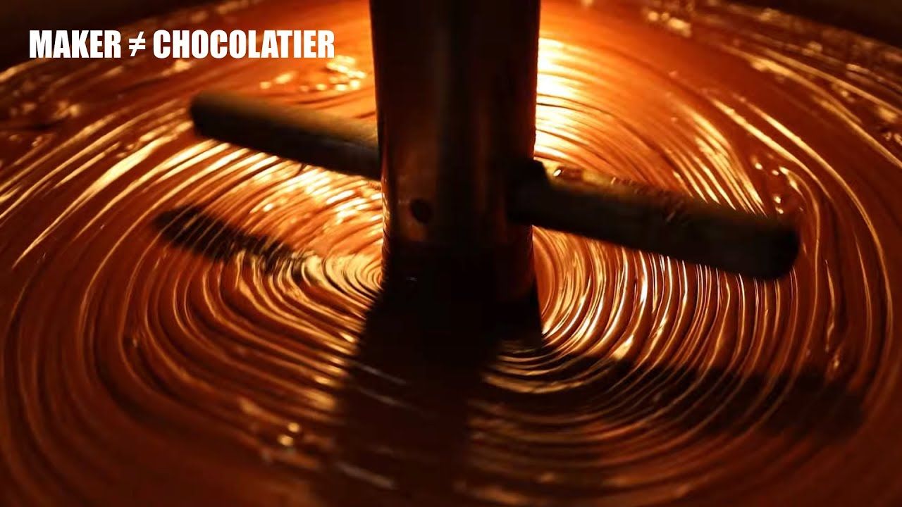 Image of liquid cholate in ball mill  with text reading "Maker not equal chocolatier".  