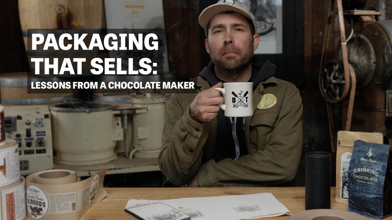 Image of man sitting at table holding a cup with text reading "Packaging that sells: Lessons From A Chocolate Maker". 