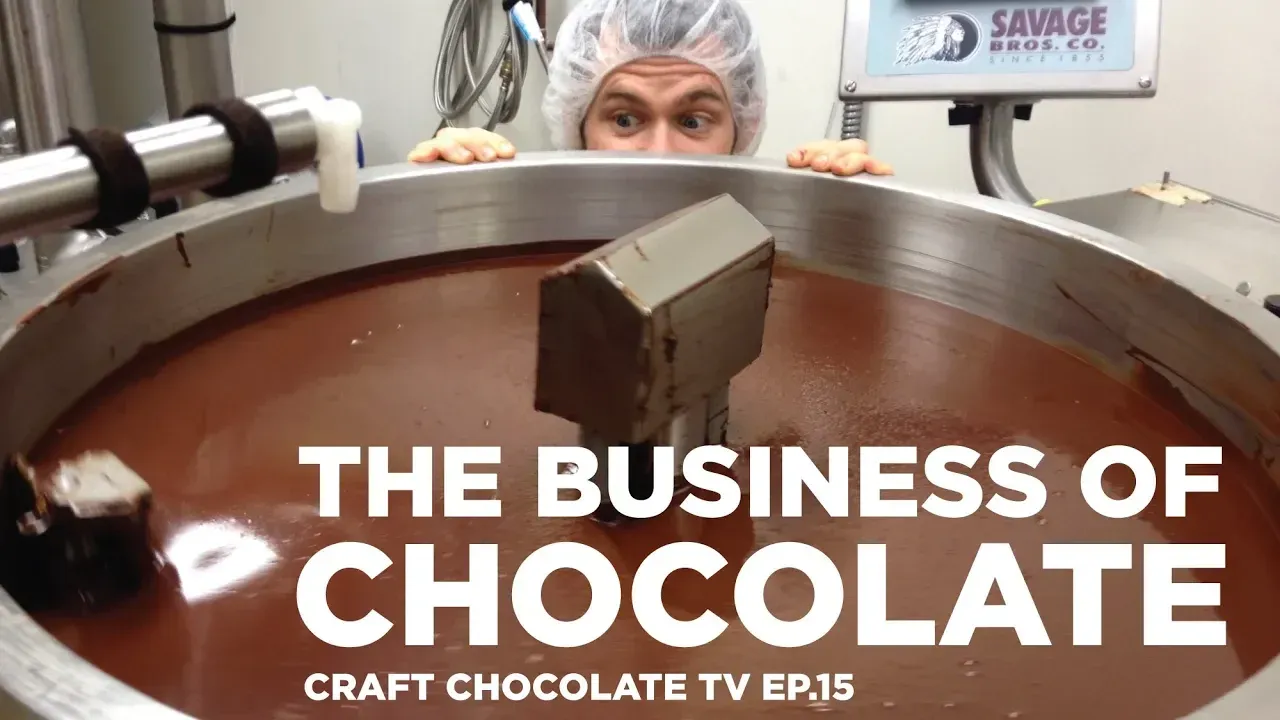 image of man peaking over tank of chocolate with text reading "The Business of Chocolate"