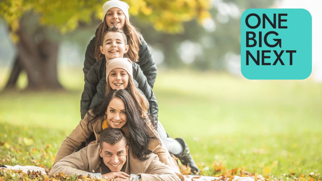 Happy family of five in the park