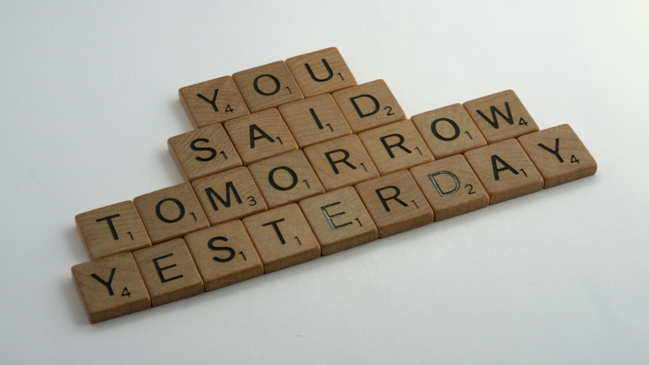 scrable letters spelling you said tomorrow yesterday