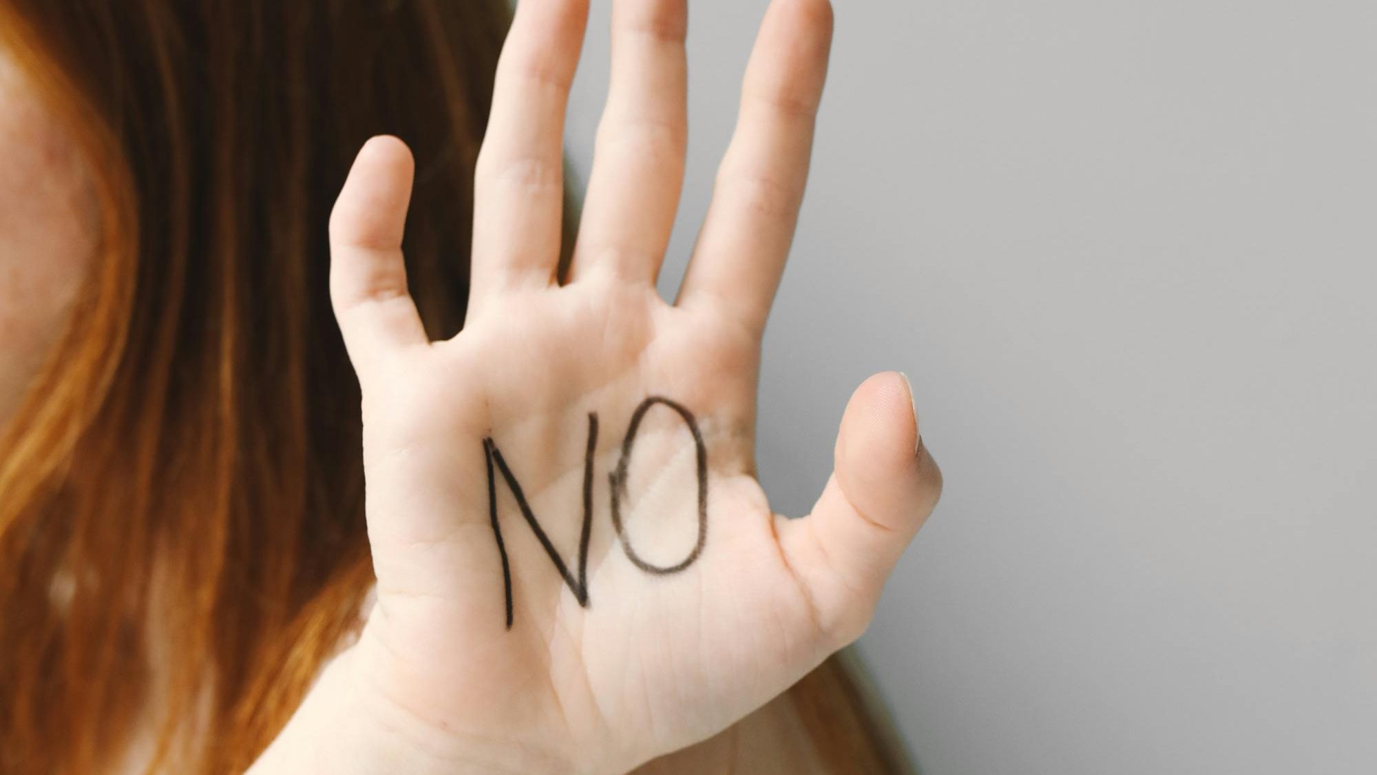 `Hand-with-"NO"-written-on-the-palm`