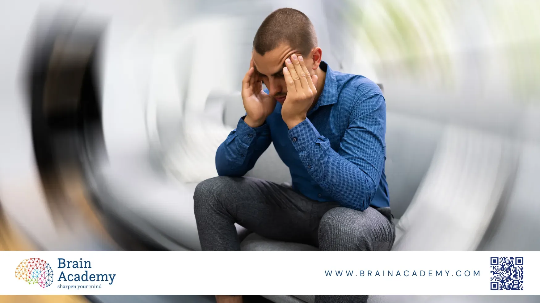 a man having holding his head in focal view