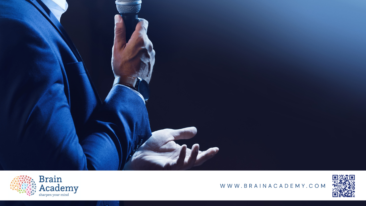 Brain coach working with a client, explaining neuroscience-based strategies for behavior change and personal development in a modern coaching session.